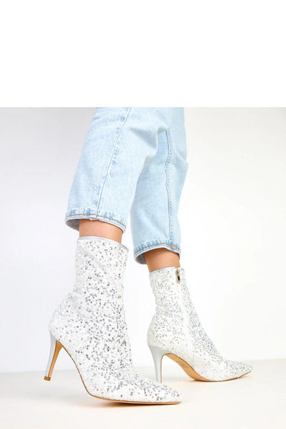 Close-up of Solea women's ankle boots highlighting the glamorous sequin detail and sophisticated design, tailored for a stunning look.