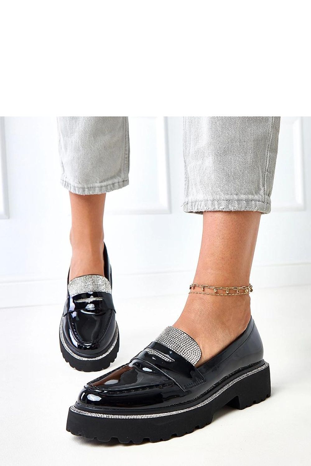 Luxurious Solea women’s moccasins in patent leather with striking zircons, designed for ultimate comfort and fashionable appeal in a variety of sizes.