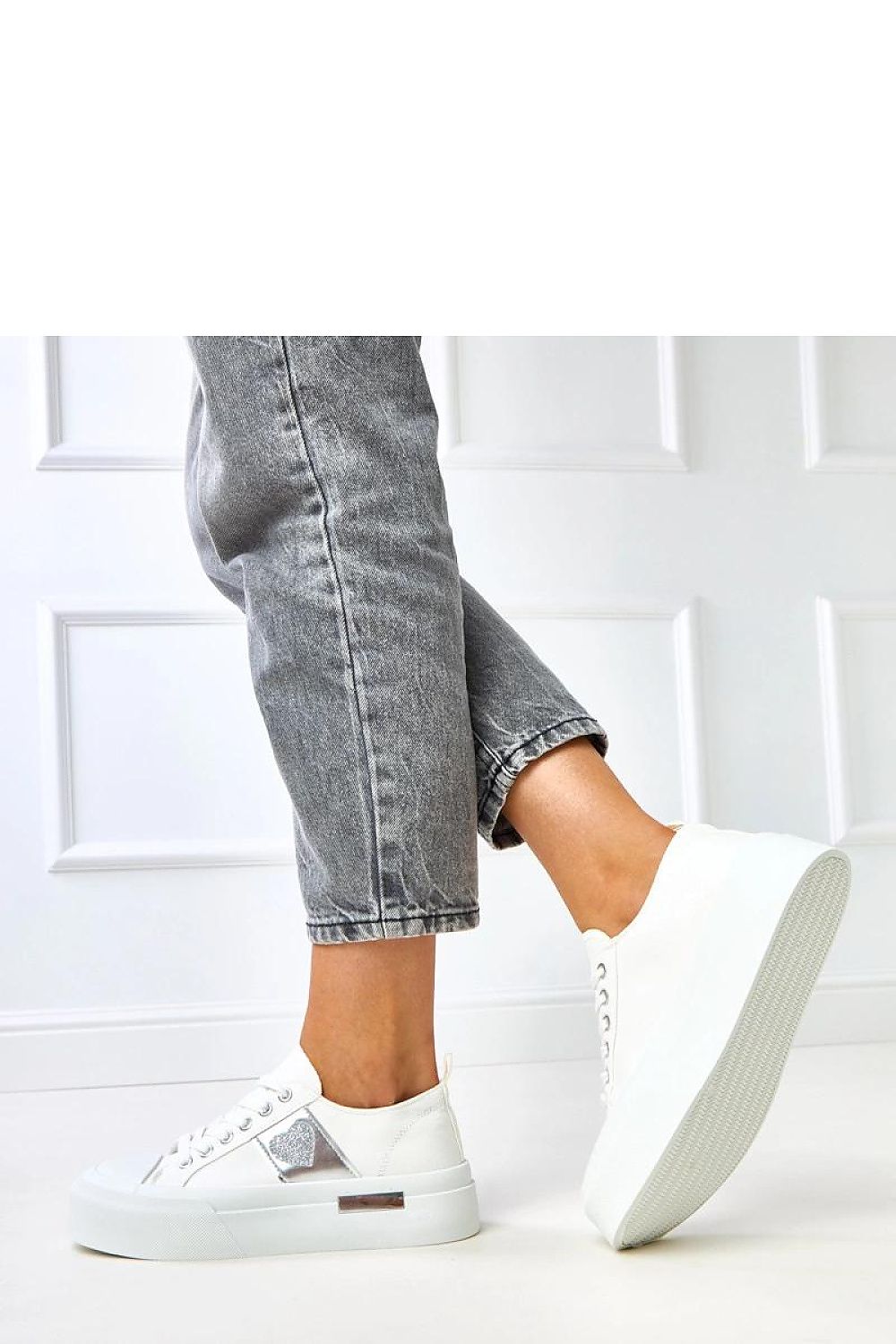 Solea Women's lightweight low-cut sport shoes featuring a stylish heart print design, perfect for an elevated sporty look.