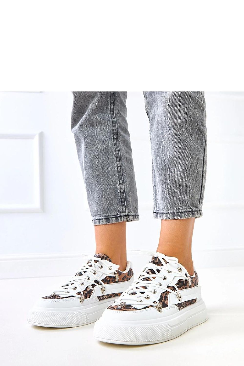 Elegant Solea sport shoes featuring chic leopard print inserts, crafted from eco-friendly leather with a luxurious 4 cm platform.