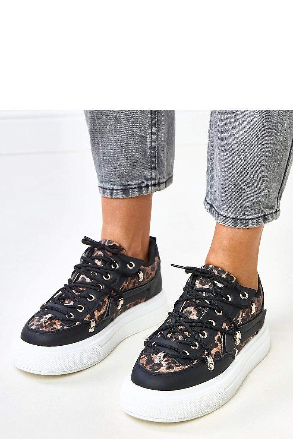 Close-up of Solea low-cut sport shoes showcasing the premium eco-leather craftsmanship and unique leopard print design, ideal for fashionable, eco-conscious women.