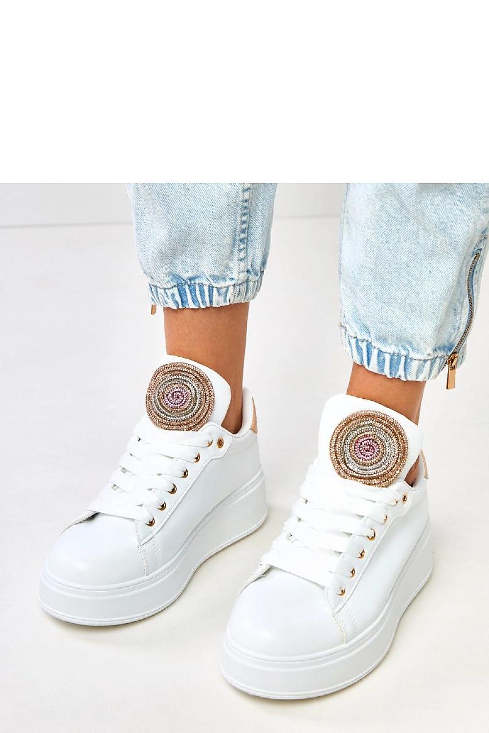 Close-up of Solea low-cut sport shoes highlighting the round toe and lacing for a perfect fit, crafted from luxurious artificial leather.