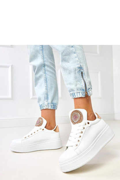 Solea sport shoes displayed elegantly with gold embellishments, perfect for enhancing everyday stylish outfits and comfort.