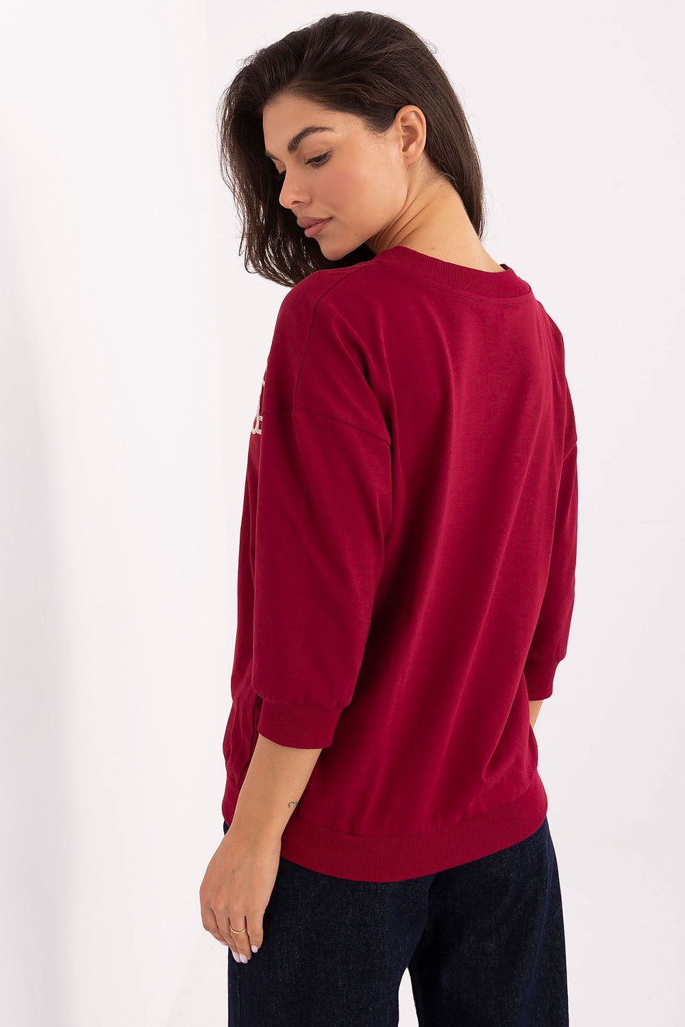 Model wearing the stylish V-neck blouse from Relevance, demonstrating its flattering fit and timeless design suitable for office and casual outfits.