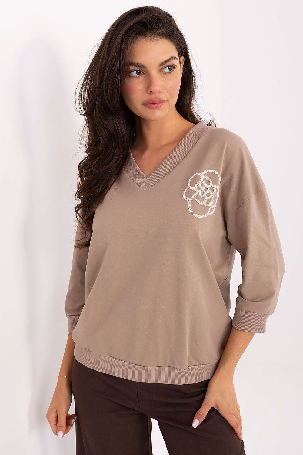 Elegant cotton blend blouse by Relevance, featuring 3/4 sleeves and a V-neck design, ideal for adding a touch of sophistication to everyday attire.