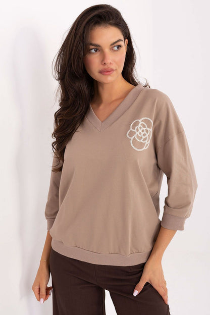 Elegant cotton blend blouse by Relevance, featuring 3/4 sleeves and a V-neck design, ideal for adding a touch of sophistication to everyday attire.