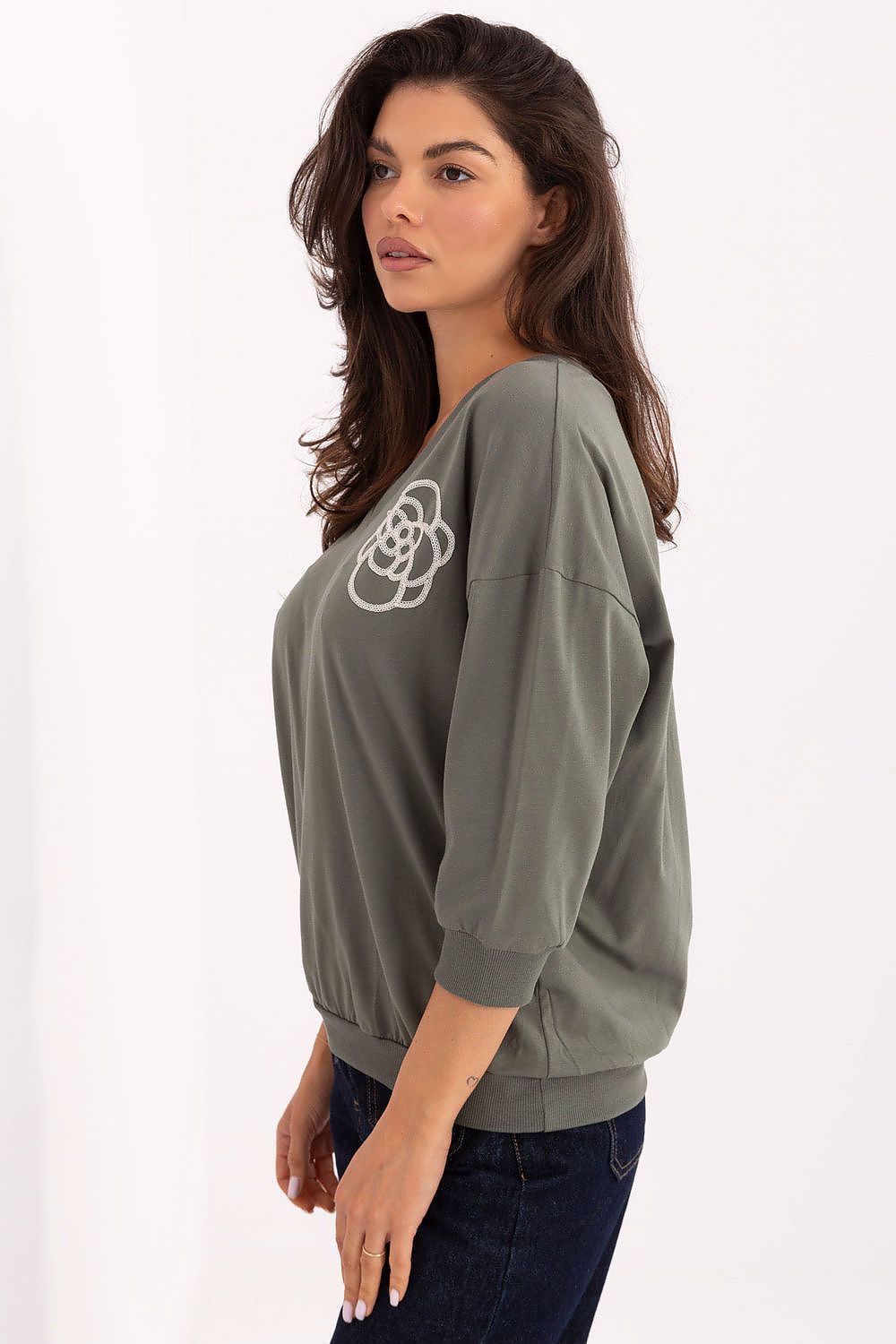 Model wearing the Elegant Cotton Blend V-Neck Blouse by Relevance, highlighting its breathable fabric and chic V-neck design ideal for elegant office attire.