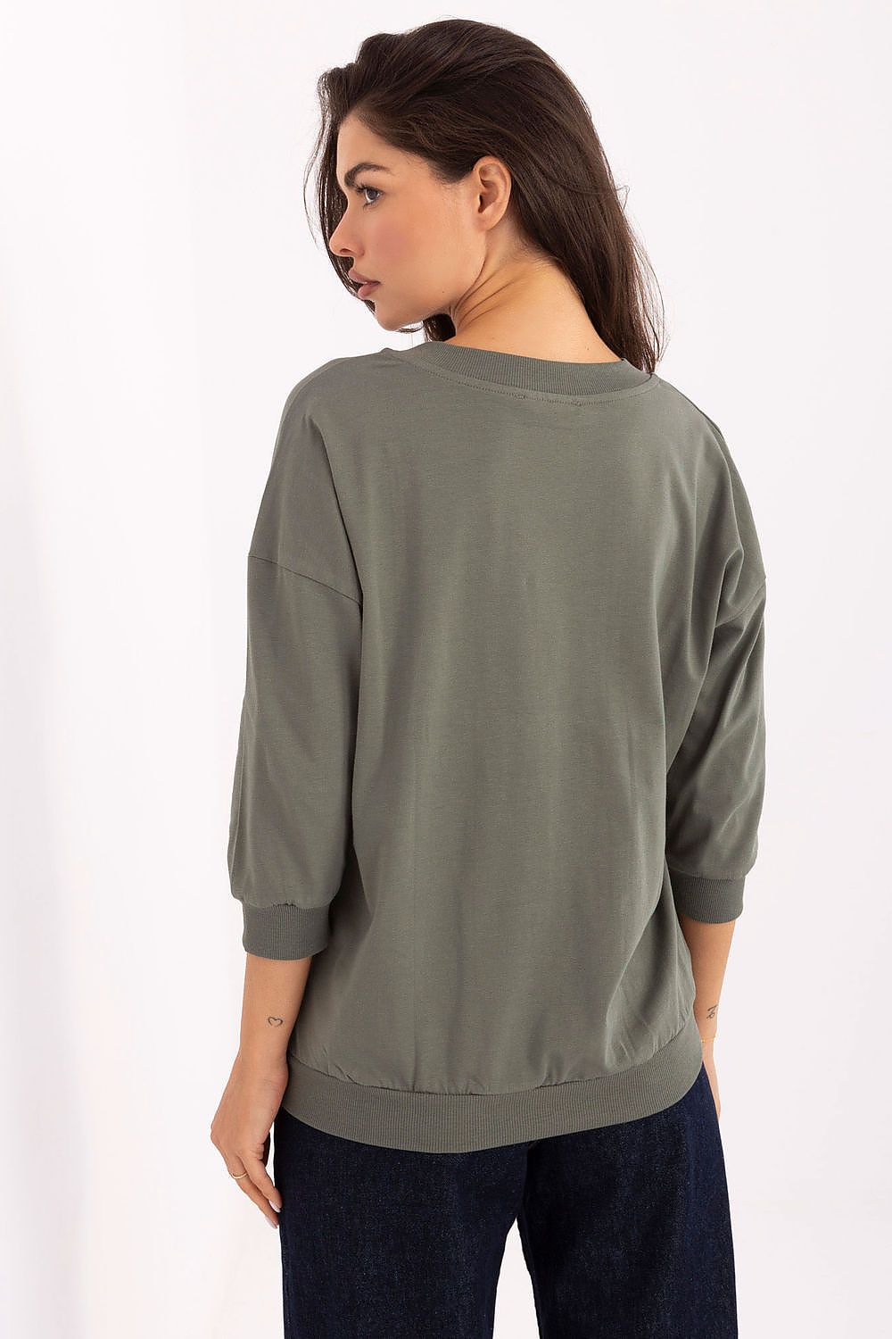 Side view of the Elegant Cotton Blend V-Neck Blouse by Relevance, demonstrating the flattering 3/4 sleeves and relaxed yet refined silhouette.