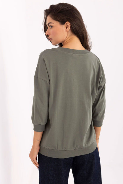Side view of the Elegant Cotton Blend V-Neck Blouse by Relevance, demonstrating the flattering 3/4 sleeves and relaxed yet refined silhouette.