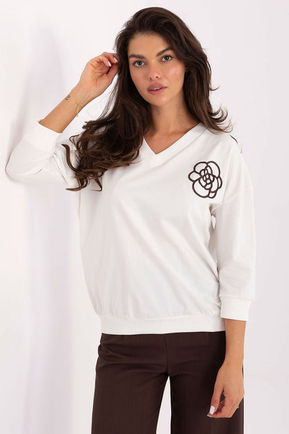 Flat lay of the Elegant Cotton Blend V-Neck Blouse by Relevance, featuring its luxurious fabric blend and subtle embroidery, perfect for fashionable layering.