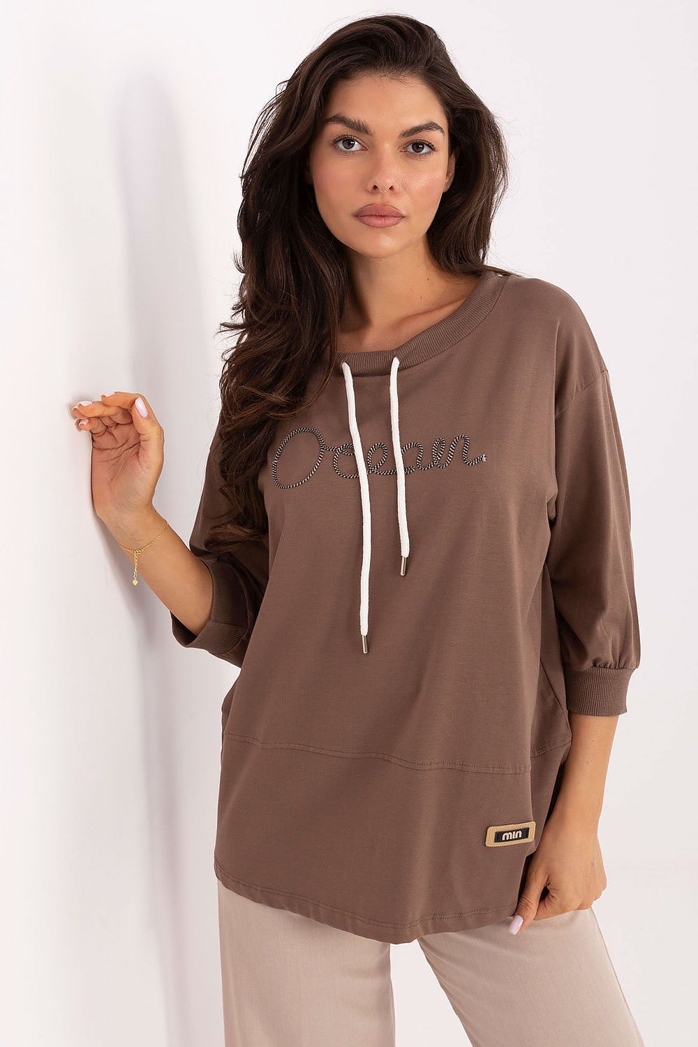 Close-up detail of the Luxury Casual Cotton Blend Blouse by Relevance showcasing the intricate embroidery and feminine decorative cords.