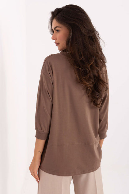 Back view of the Luxury Casual Cotton Blend Blouse by Relevance, designed with comfortable 3/4 sleeves and modern patch detailing on the left side.