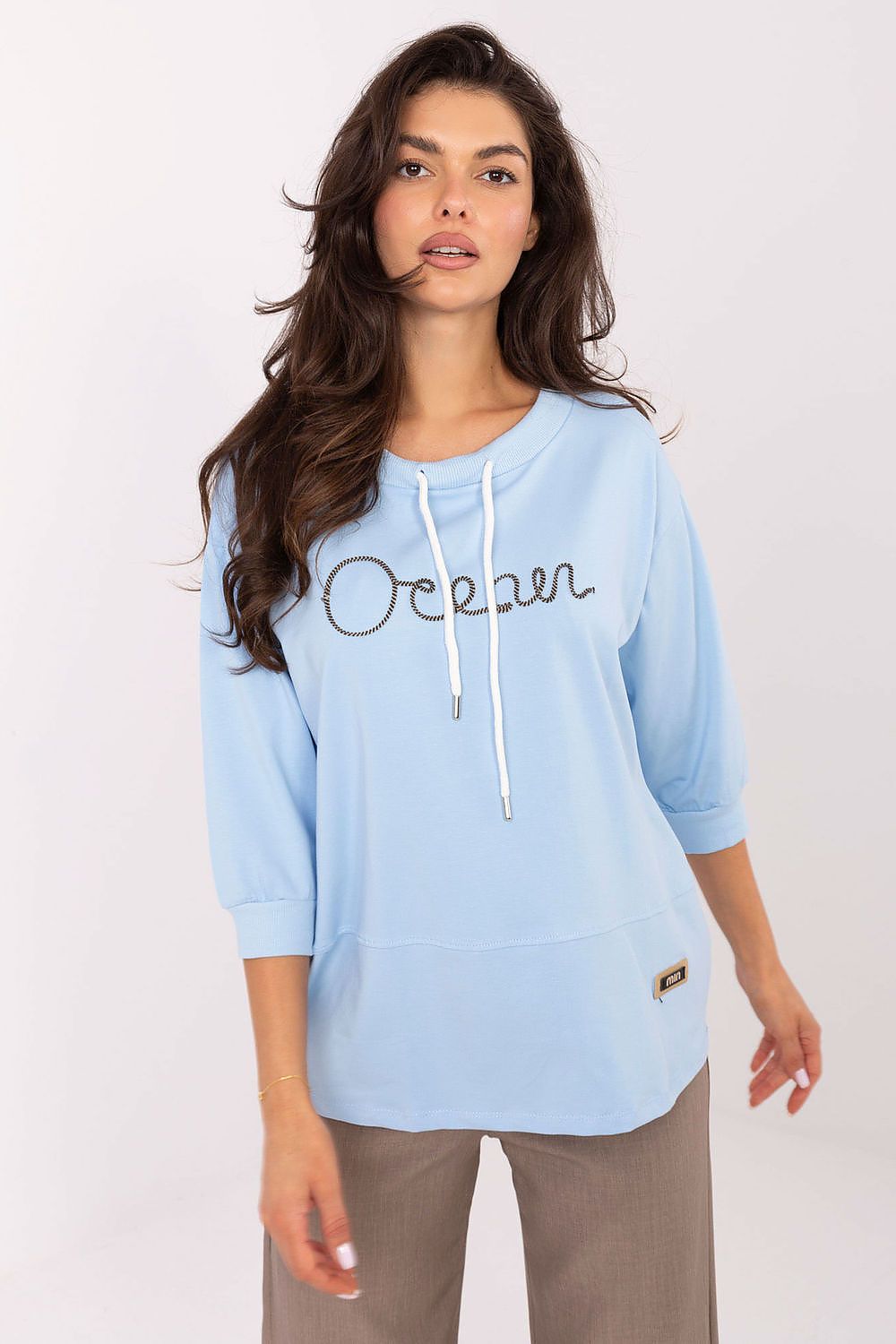 Fashionable shot of the Luxury Casual Cotton Blend Blouse by Relevance, emphasizing its standard length and flattering round neckline.