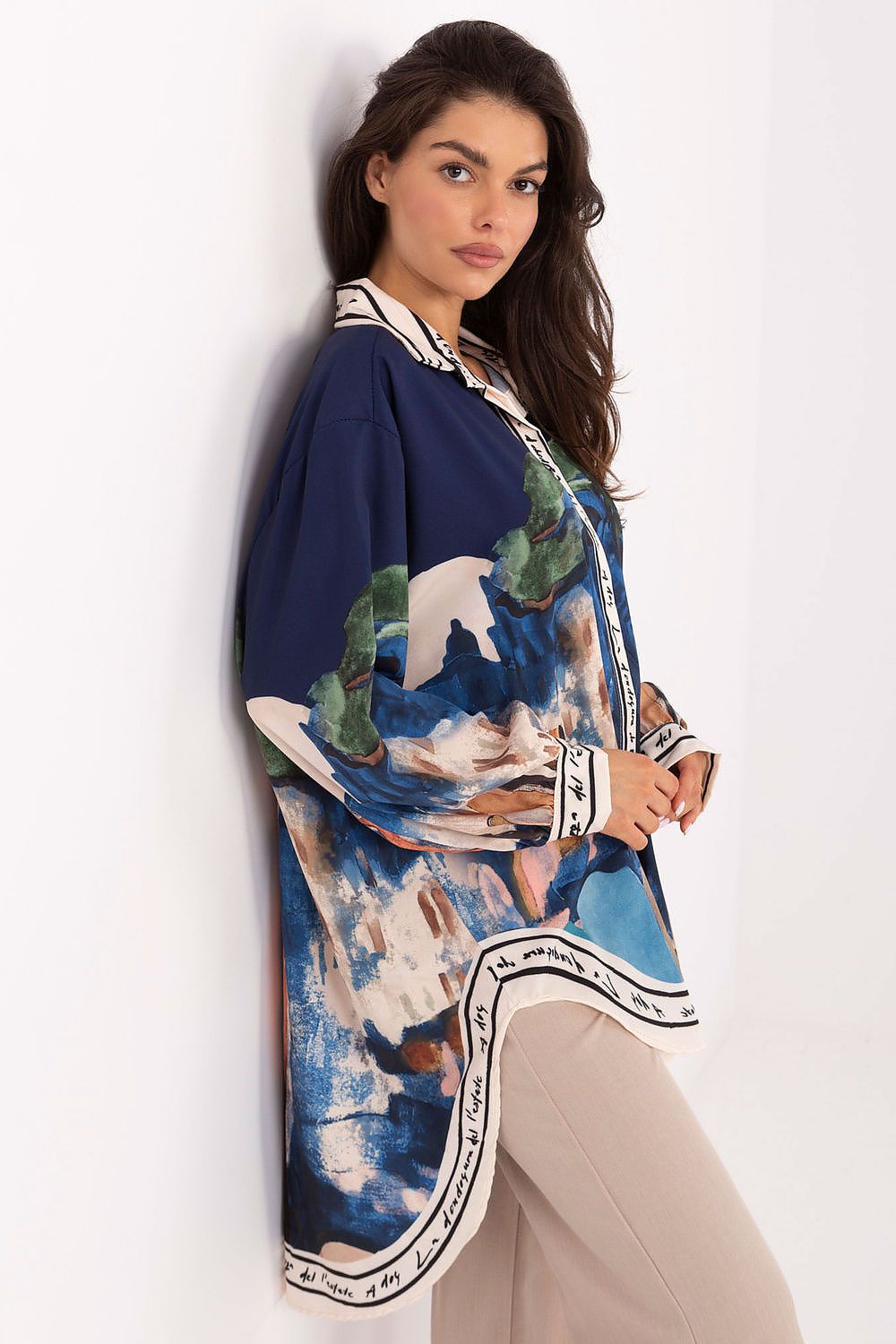 Model wearing Rue Paris Women's Long Sleeve Shirt, depicting its longer cut and chic collar in a casual setting.