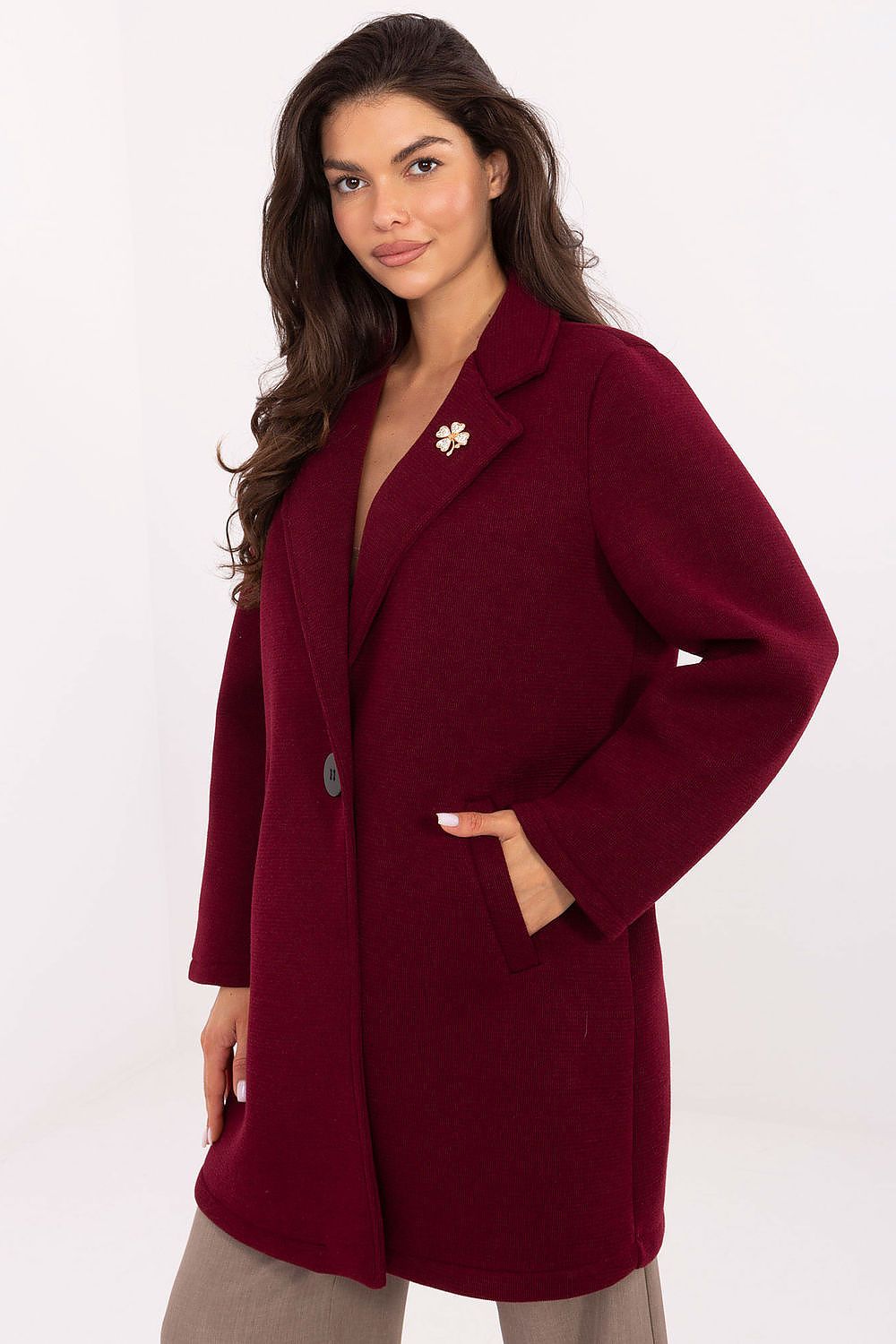 Elegant Rue Paris women's coat showcasing lightweight foam fabric, featuring a decorative brooch, perfect for transition seasons.