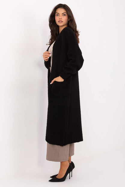 Sophisticated knee-length cardigan for women by Italy Moda, blending elegance and functionality with its smooth texture and refined silhouette.