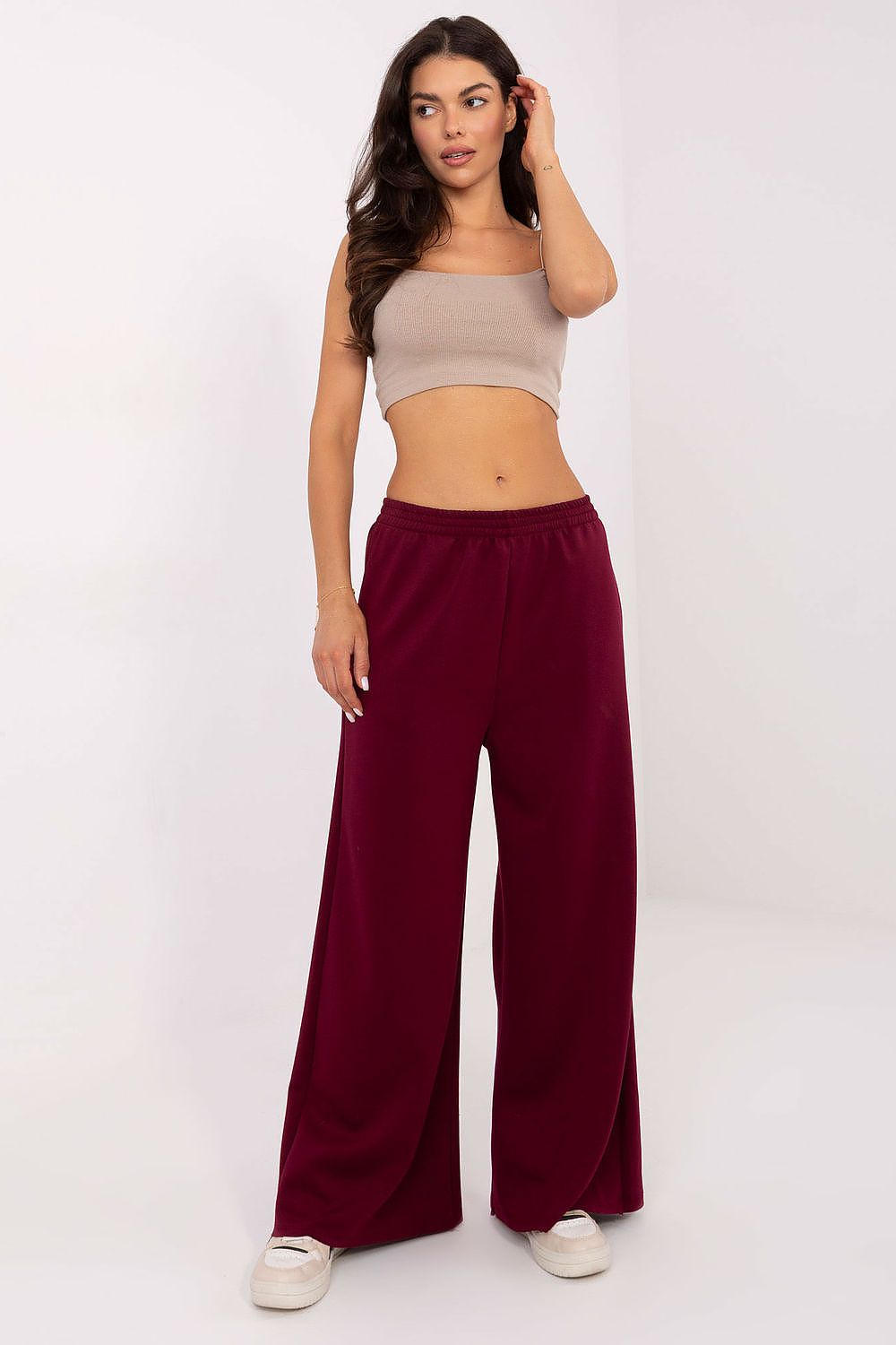 Chic palazzo tracksuit trousers by Italy Moda in elegant black, designed for comfort and style with side pockets.