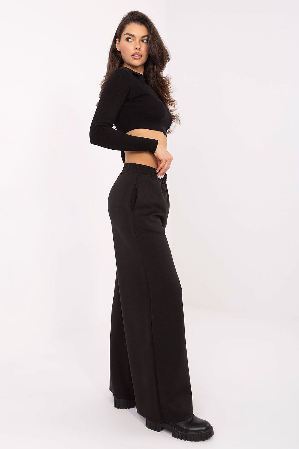 Elegant high waist palazzo trousers by Italy Moda, showcasing a wide leg silhouette with a buttery smooth texture, designed for everyday luxury.