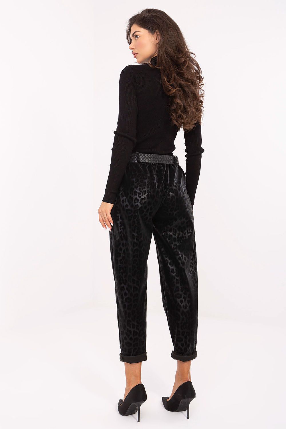 Luxury Women's high-waisted faux leather trousers with bold leopard print by Italy Moda, featuring a stylish fitted silhouette and side slip pockets.