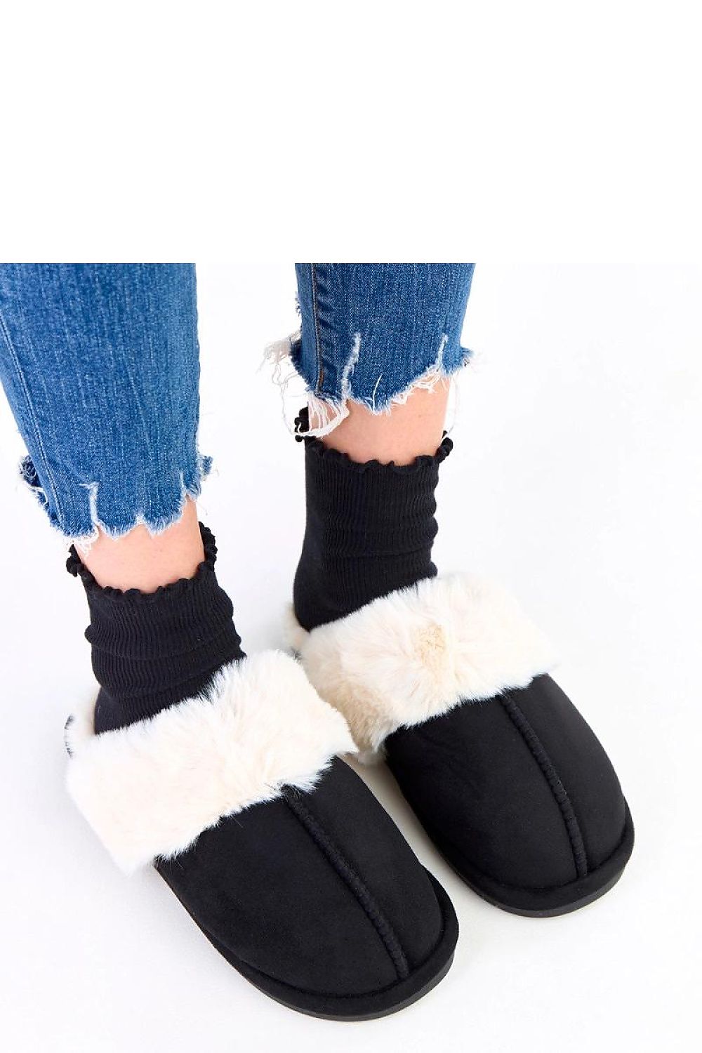 Lifestyle image of Solea Women's fur slippers worn indoors, illustrating their chic look and comfort, perfect for stylish relaxation.