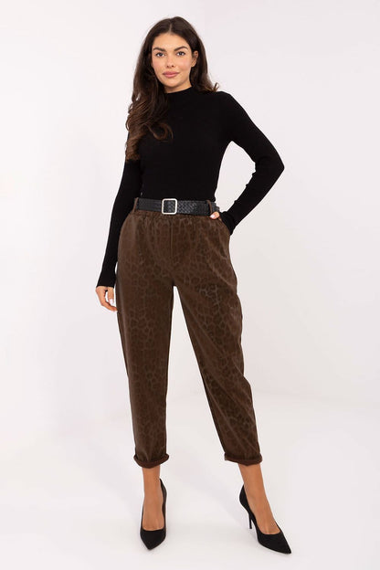 Italy Moda luxury women's high-waisted faux leather trousers, highlighting the tapered legs and trendy leopard print for a fashionable look.