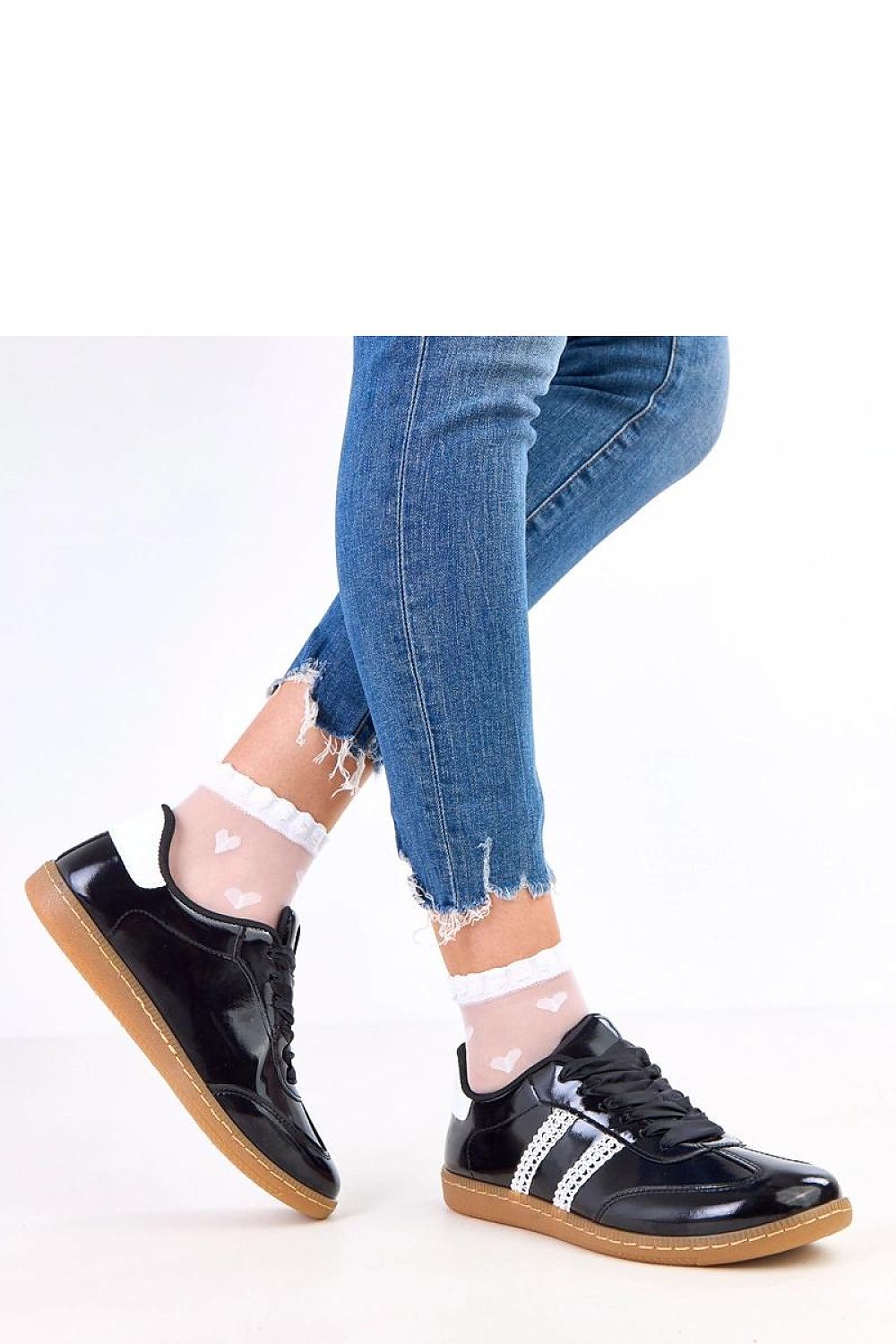 Close-up of Solea's luxurious sport shoes for women in eco leather, showcasing the exquisite satin lacing and high-quality craftsmanship.