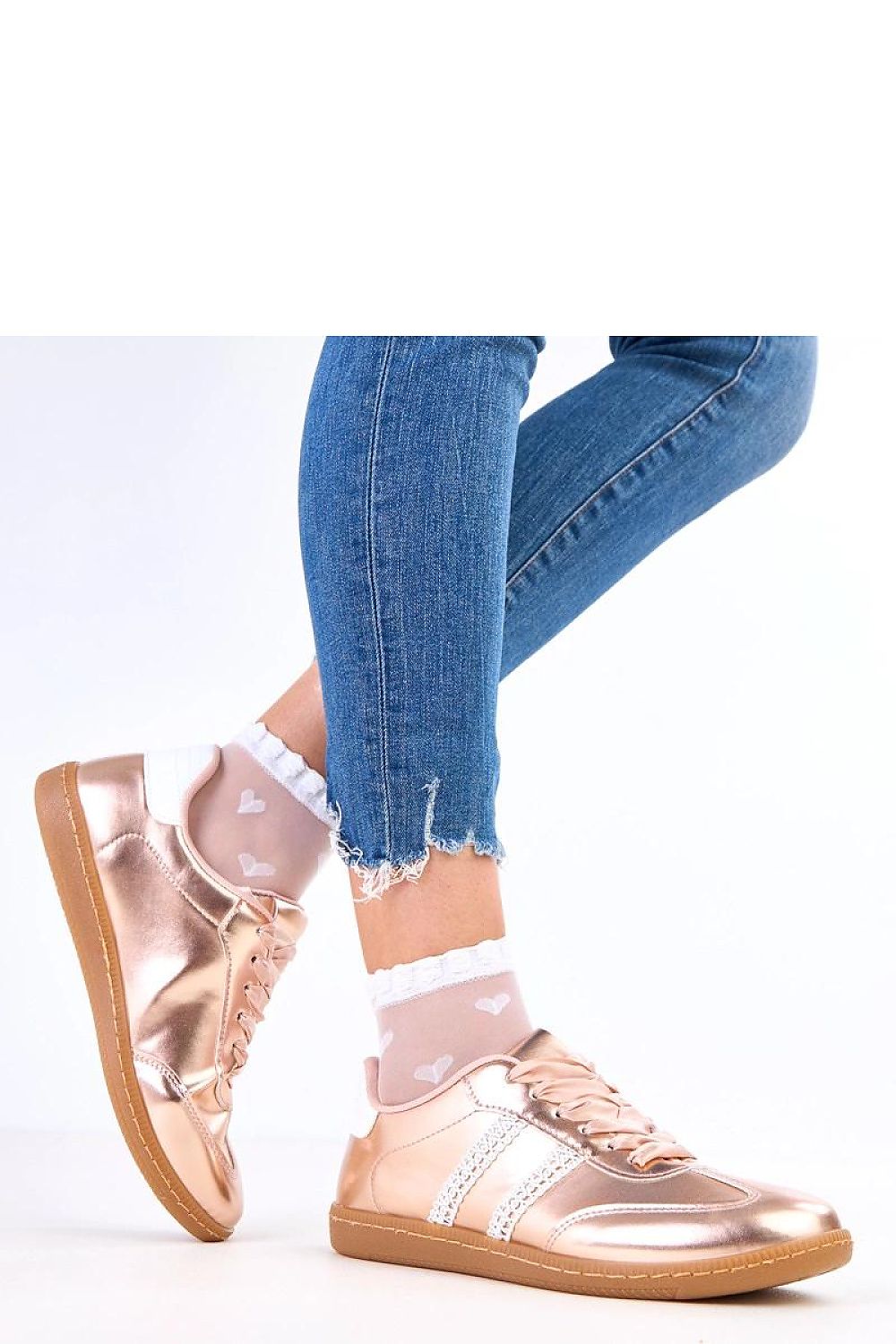 Elegant women's sport shoes by Solea in eco leather with satin laces, showcasing modern design and feminine accents.