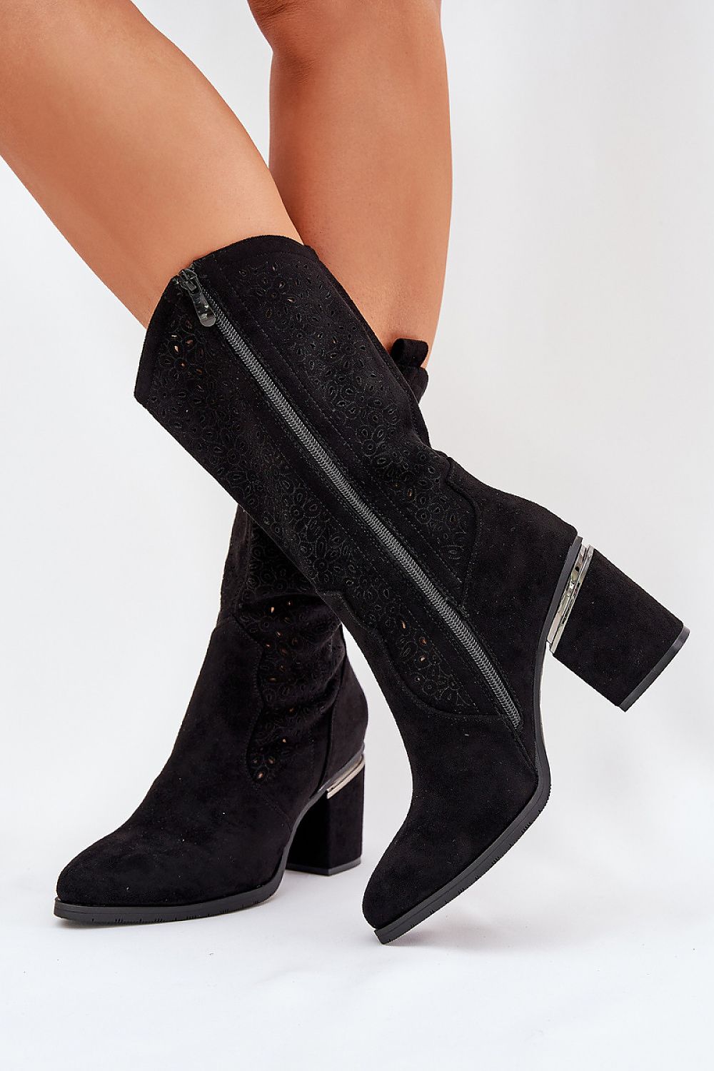 Stylish side view of Step in Style women's elegant eco suede open-work boots featuring a chic column heel and durable design.