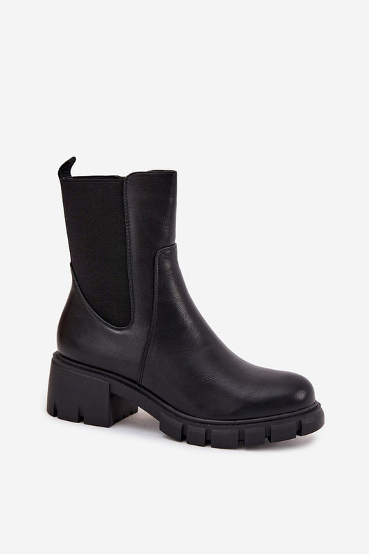 Elegant Jezzi Eco Leather Ankle Boots with a rounded toe and sturdy block heel, showcasing a chic side zipper for easy wear, ideal for luxury fall styling.