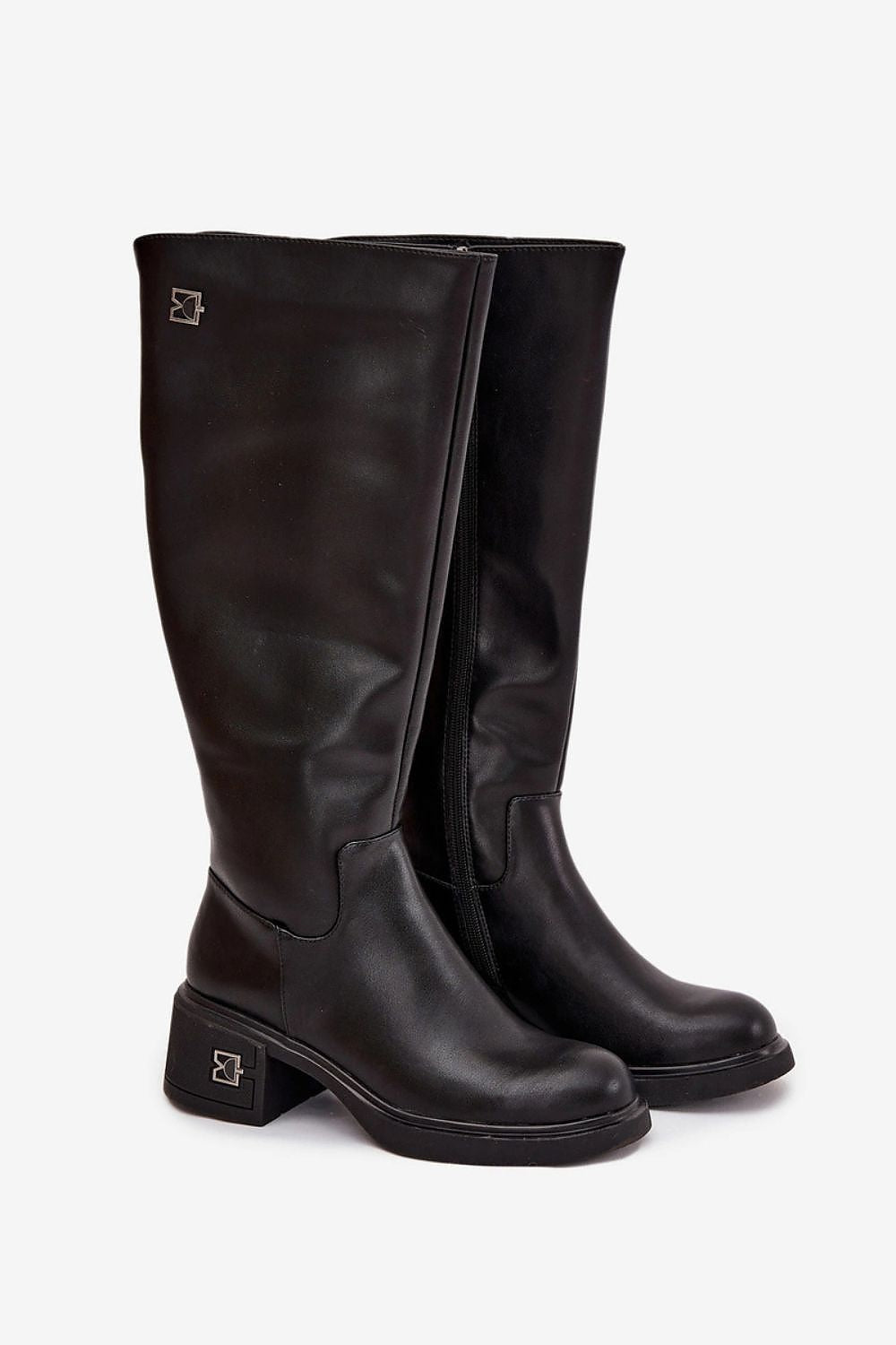 Close-up of Step in Style's elegant women's natural leather heel boots, highlighting the luxurious zipper and exquisite craftsmanship, ideal for both everyday wear and elegant occasions.