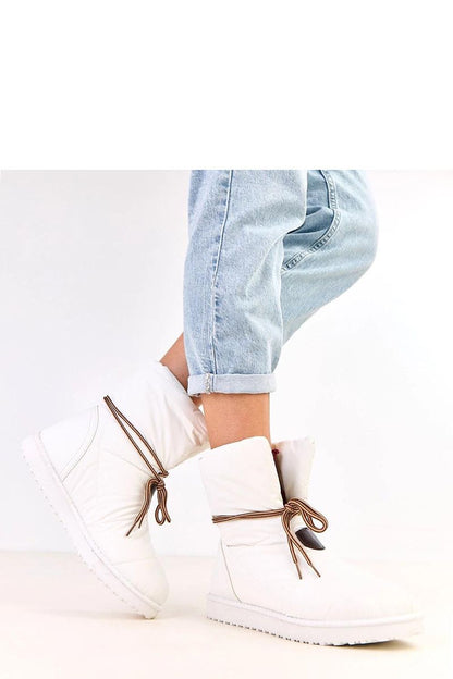 Luxury women's snow boots by Solea featuring decorative laces, designed for warmth and comfort during winter.