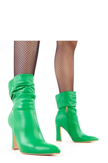 Close-up of Solea ankle boots in eco leather, displaying the textured ruching and stable heel perfect for sophisticated outfits.