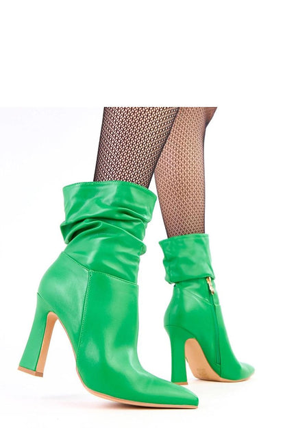 Solea ankle boots styled with a fashionable outfit illustration, featuring 10.5 cm high heels and eco leather craftsmanship ideal for elegance.