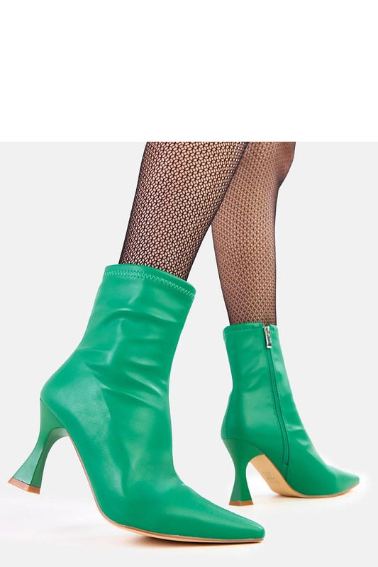 Close-up of Superior quality eco-leather high-heeled ankle boots by Solea, featuring a pointed toe and delicate heel, ideal for an elegant look on any occasion.