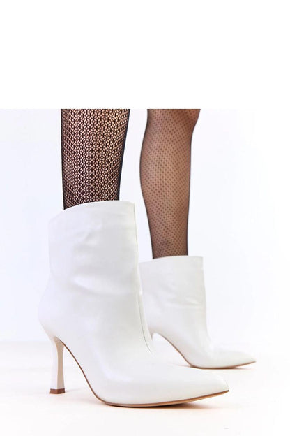 Solea high-heeled lacquered ankle boots in eco-friendly leather showcasing their elegant design and shiny finish.