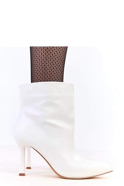 Solea high-heeled leather ankle boots featuring a graceful 13cm upper, perfect for modern elegant ensembles.