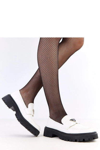 Close-up view of Solea's luxurious slip-on loafers showcasing the intricate metal accent and soft ecological leather, combining sophistication and comfort.