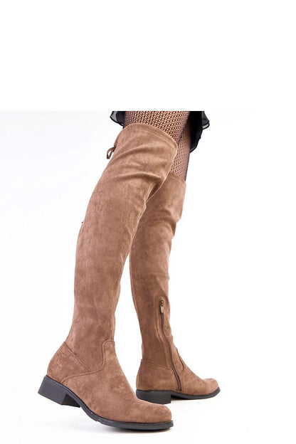 Solea eco-leather over-the-knee boots featured with a focus on the rounded toe and low heel for stability.