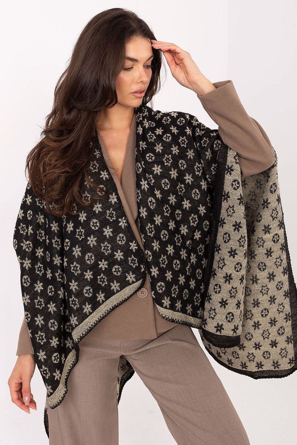 Fashion-forward poncho from Factory Price, crafted from 100% acrylic with a unique pattern, offering effortless elegance for modern women.