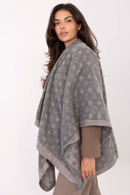 Factory Price's chic poncho made of 100% acrylic, offering a relaxed fit and standout design, ideal for both casual and casual-chic occasions.