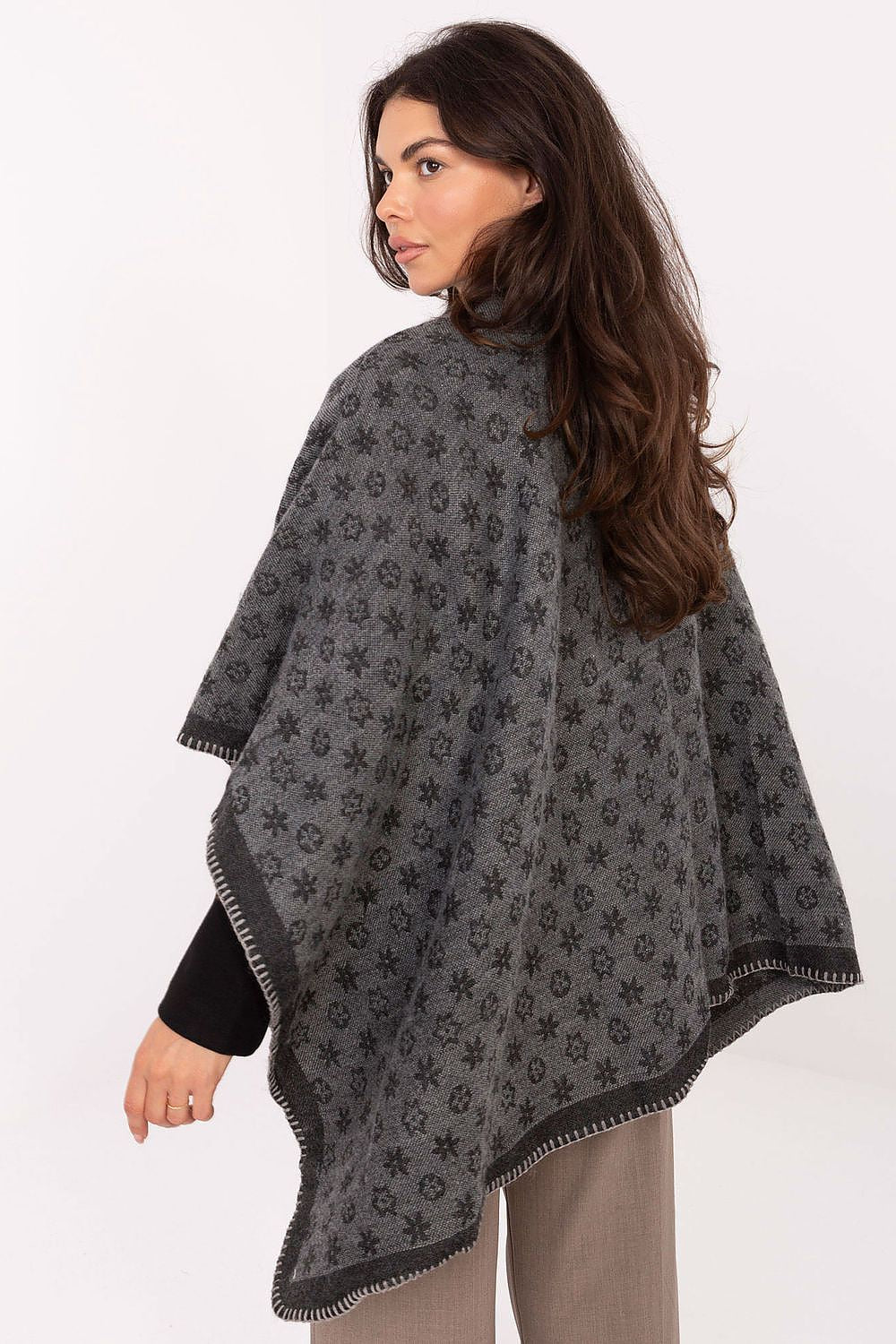 Chic 100% Acrylic Poncho from Factory Price, showcasing a stylish design for women who appreciate both comfort and fashion.