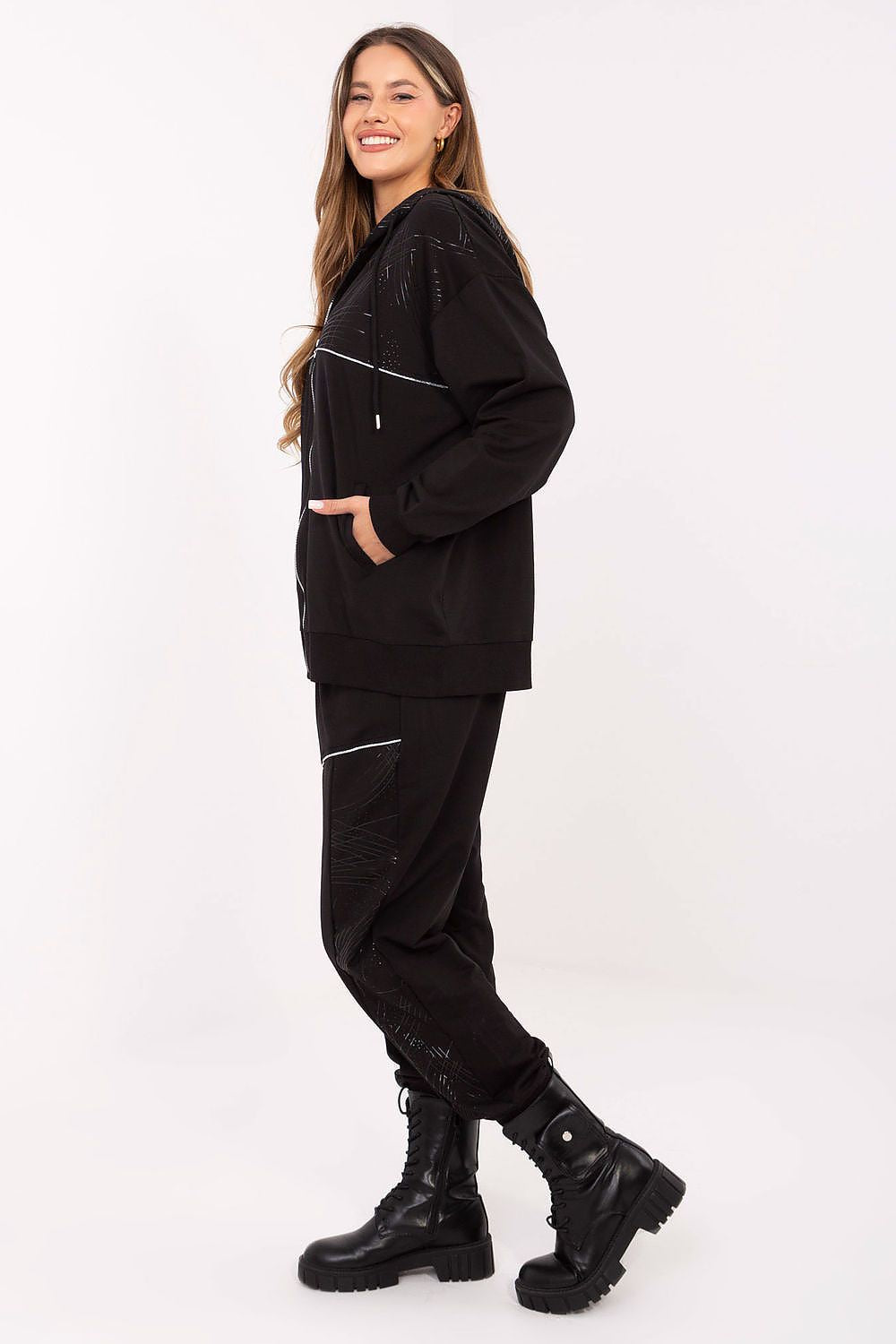 Back view of Relevance's luxurious zip-up hoodie paired with casual high waist pants, exemplifying the perfect blend of comfort and fashion for women.