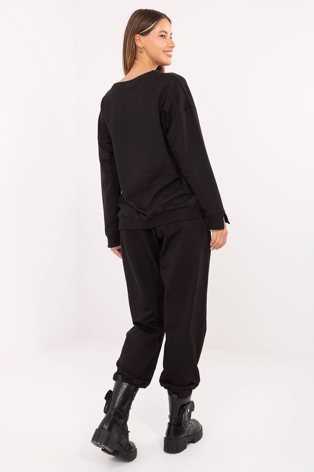 Chic close-up of Relevance's women's cotton tracksuit set showcasing intricate embroidery details on the sweatshirt, designed for fashion-forward comfort.