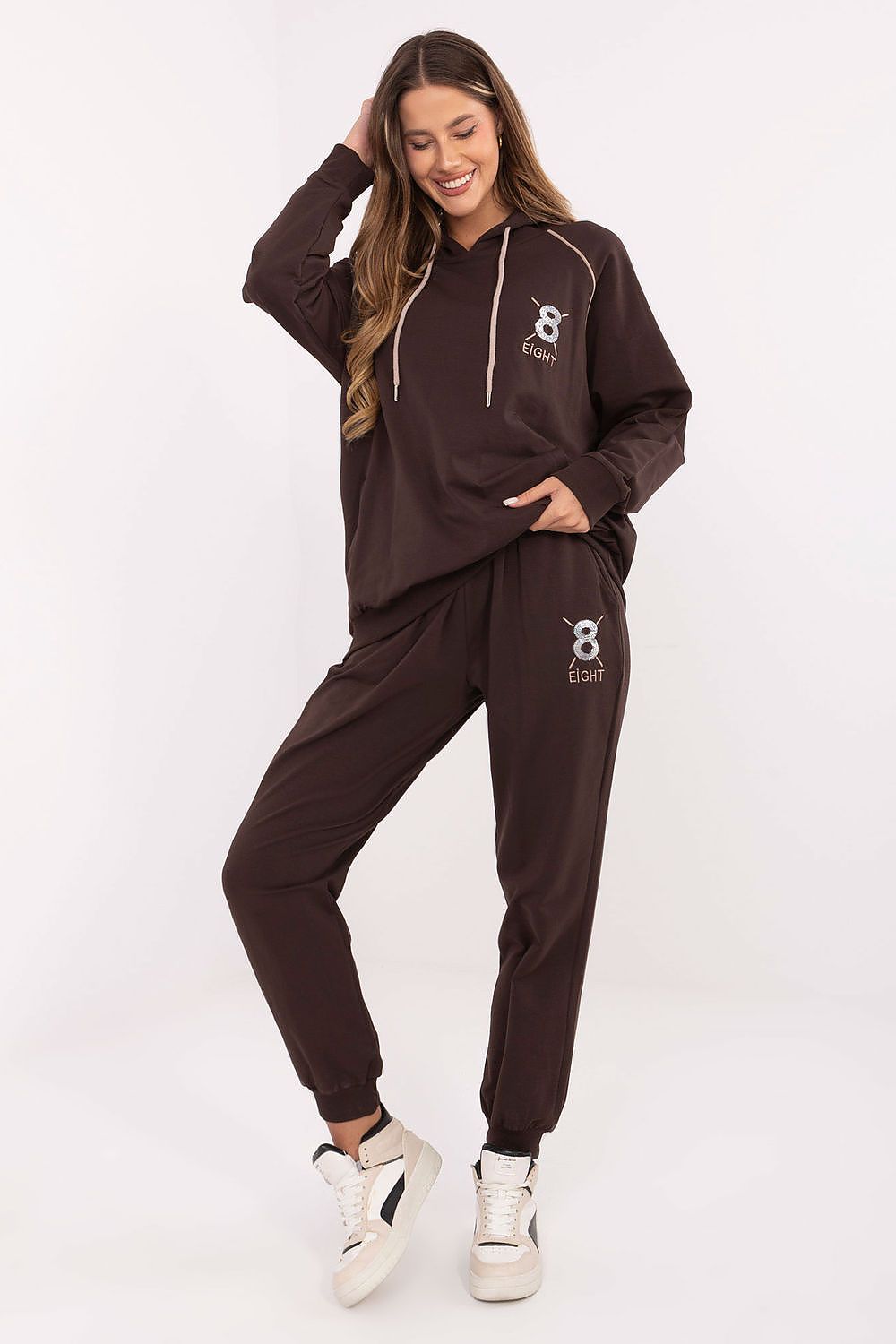 Elegant women's casual tracksuit set featuring an embellished hoodie and high-waisted pants, perfect for stylish everyday wear by Relevance.