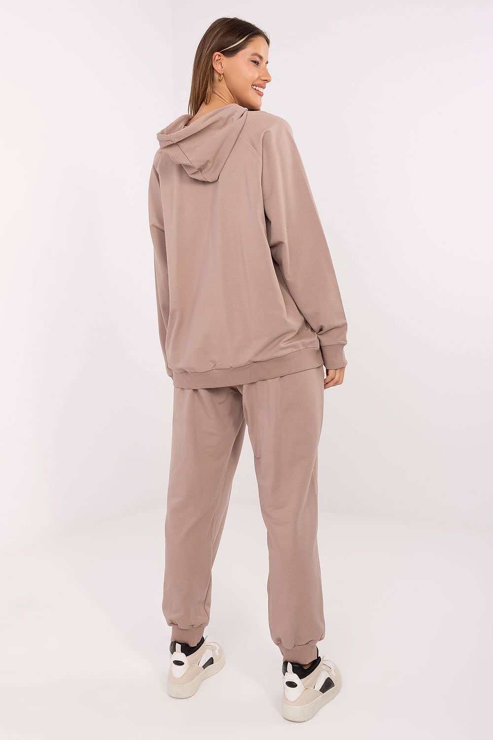 Elegant high-waisted pants with cuffs from Relevance, designed for comfort and sophistication, complementing the embellished hoodie in a casual tracksuit set.