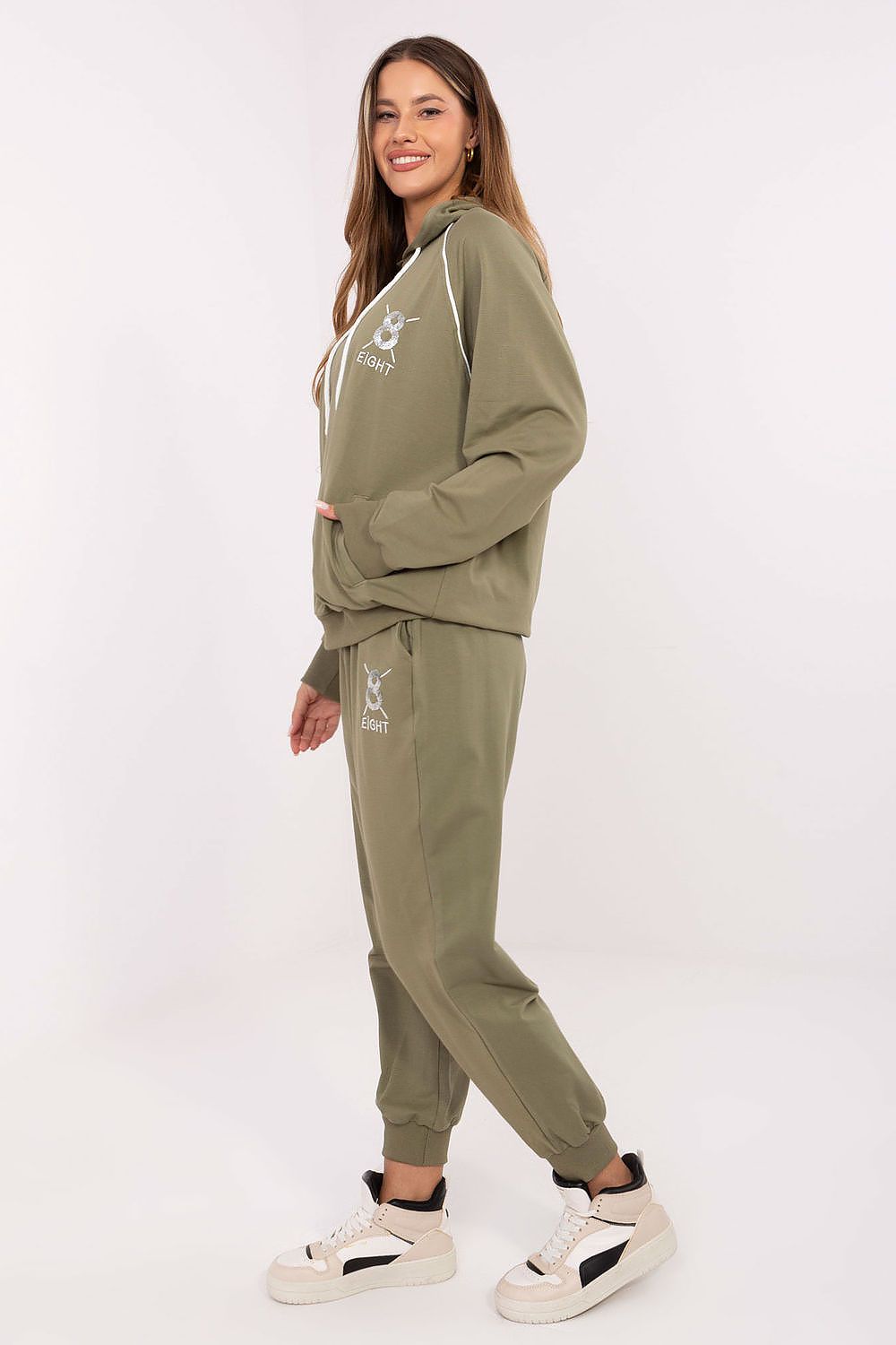 Fashion-forward view of Relevance's women’s casual tracksuit set, featuring a beautifully designed embellished hoodie and modern high-waisted trousers.