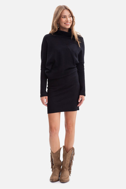 Chic BeWear Mini Ribbed Daydress worn by model, capturing the mini length and elegant high collar, ideal for a timeless wardrobe.