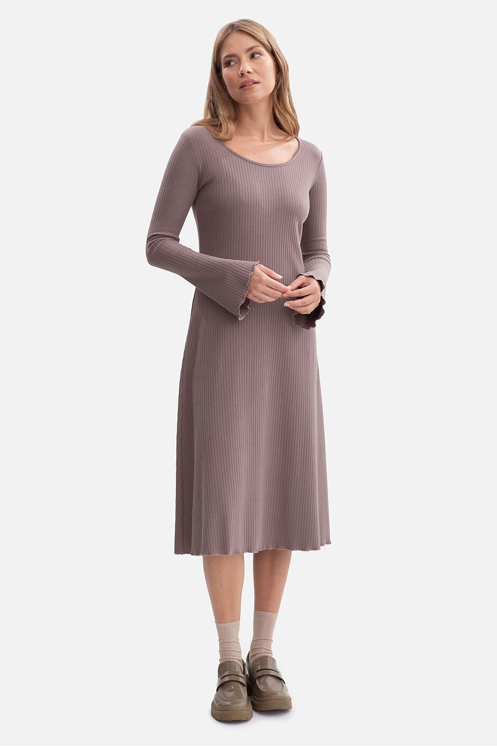 Close-up of BeWear's midi daydress, highlighting the delicate wavy bottom and sleeve finishes, emphasizing its romantic and sophisticated design.
