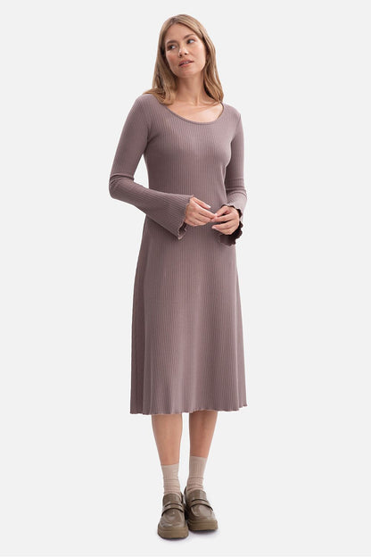 Close-up of BeWear's midi daydress, highlighting the delicate wavy bottom and sleeve finishes, emphasizing its romantic and sophisticated design.
