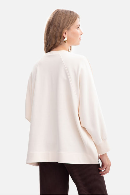 Sophisticated BeWear women's sweatshirt detailing side slits for added flair and freedom of movement, crafted from high-quality fabric.